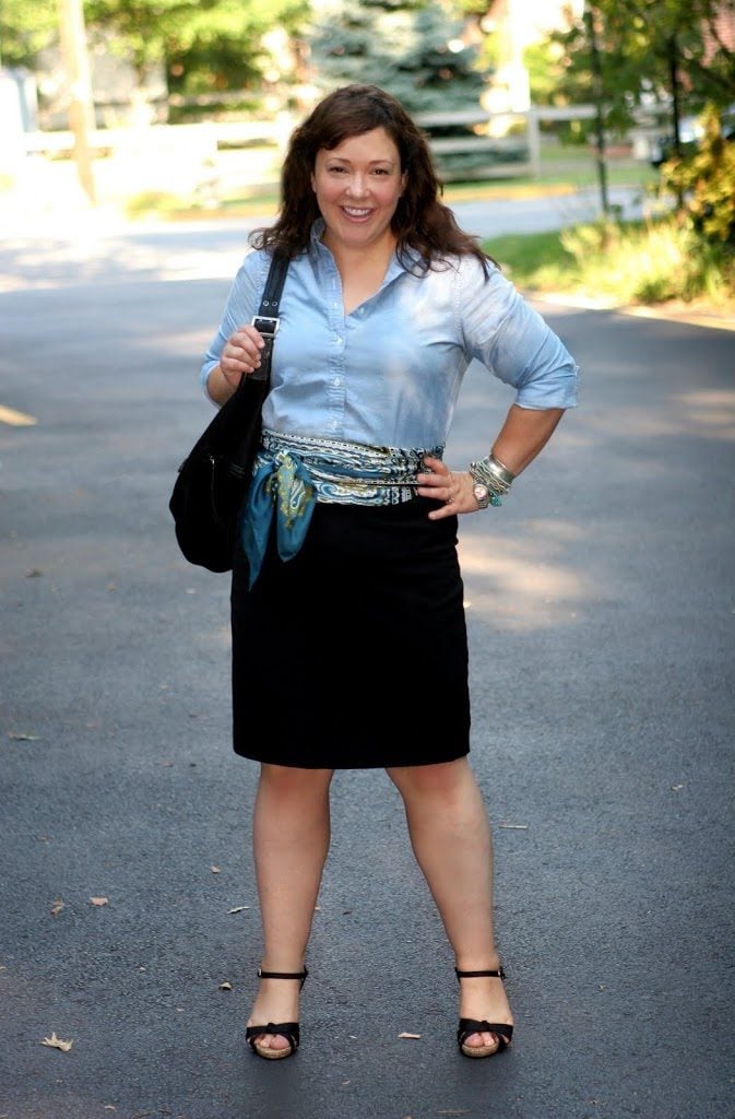 My Wardrobe Today - Wednesday Jul 13, 2011 1 Alison Gary of Wardrobe Oxygen, an over 40 style advice blog. It is July 2011 and she is wearing an outfit of a button down shirt tucked into a pencil skirt with an oversized paisley scarf tied as a cummerbund. She is holding a black leather handbag from Banana Republic and wearing wide width sandals from Payless. She has an arm party and epitomizes workwear and career fashion in 2011.