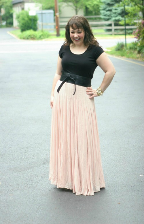 blush pink ballet maxi skirt woman in a black scoop neck fitted t-shirt tucked into a blush pink ballet maxi skirt from Ann Taylor