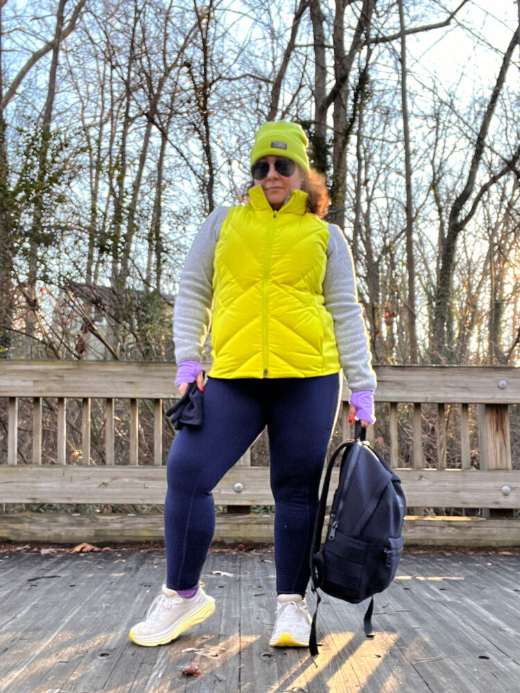 Dagne Dover Dakota Backpack Woman in winter athletic gear carrying a large Dagne Dover Dakota backpack full of heavy weights for rucking