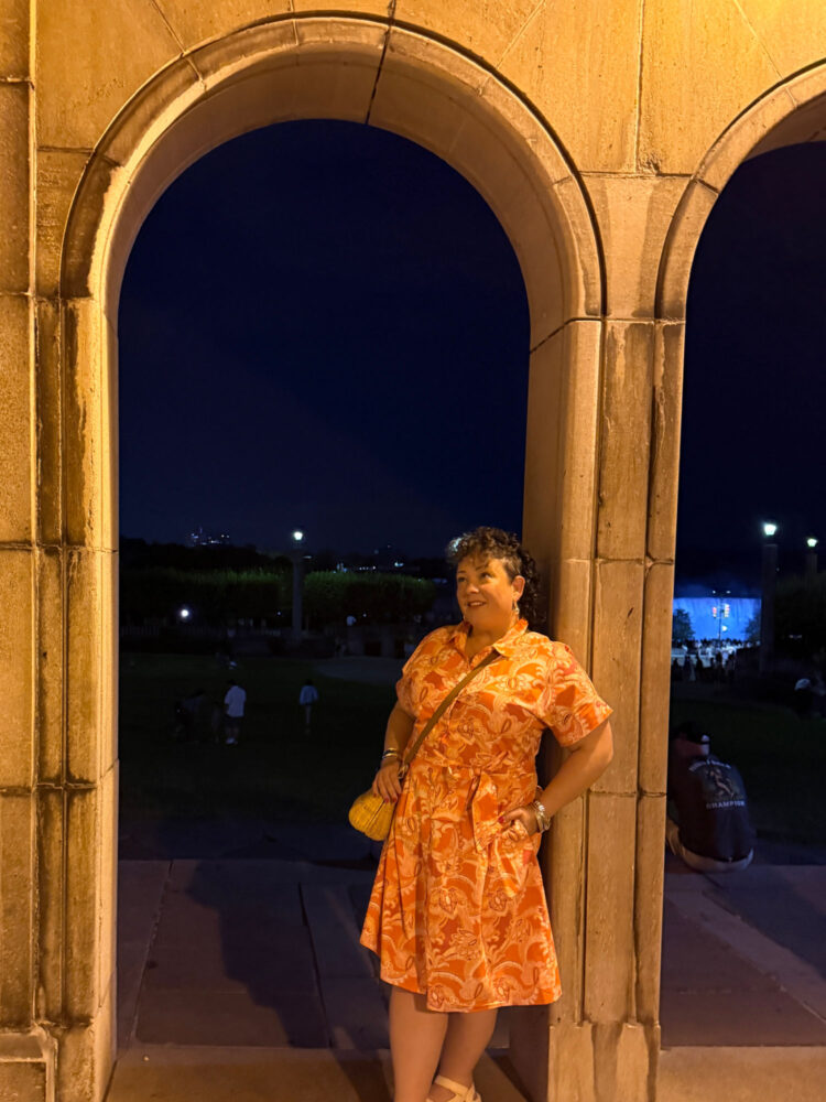 6 Ideas for Styling Shirtdresses 4 woman in Niagara Falls, Canada in a floral cotton shirtdress from Talbots holding a raffia clutch purse