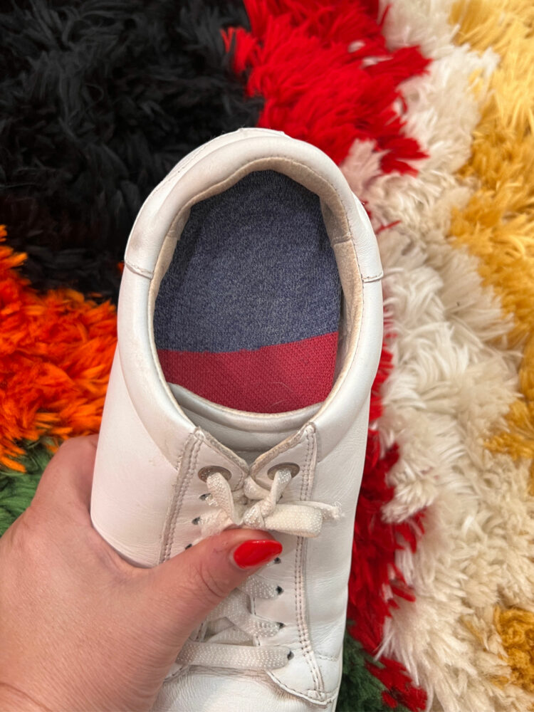 showing the sock-covered insole back in the shoe, the sock opening is not showing because it is under the insole