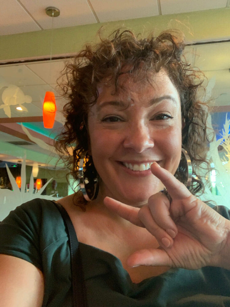 alison gary of wardrobe oxygen with thin curly hair