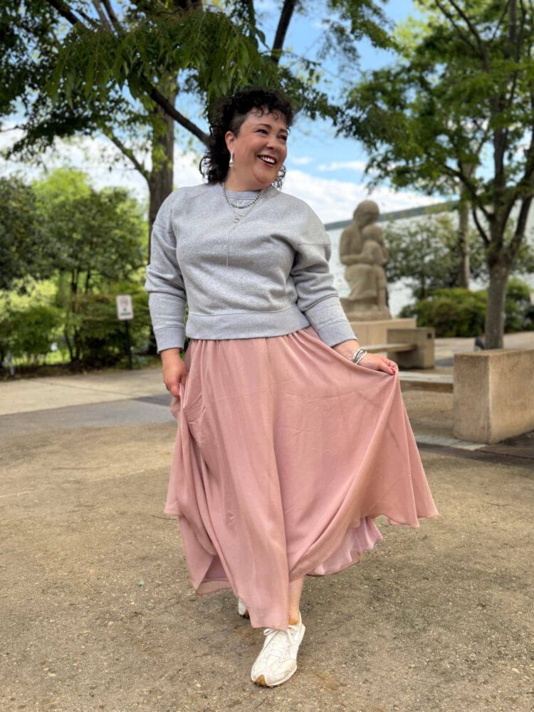 Then and Now woman in a gray sweatshirt and long pink ballerina skirt from ann taylor