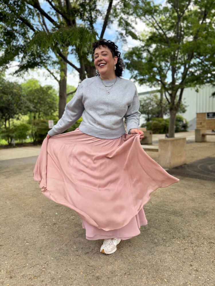 Then and Now woman in a gray sweatshirt and long pink ballerina skirt from ann taylor