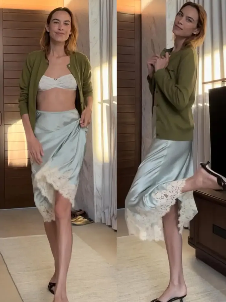 Model and television host Alexa Chung wearing a cardigan sweater and lace-trimmed slip skirt