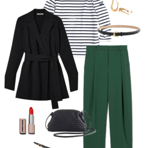 Black belted wrap jacket layered over a Breton stripe top with green trousers and black slingback flats