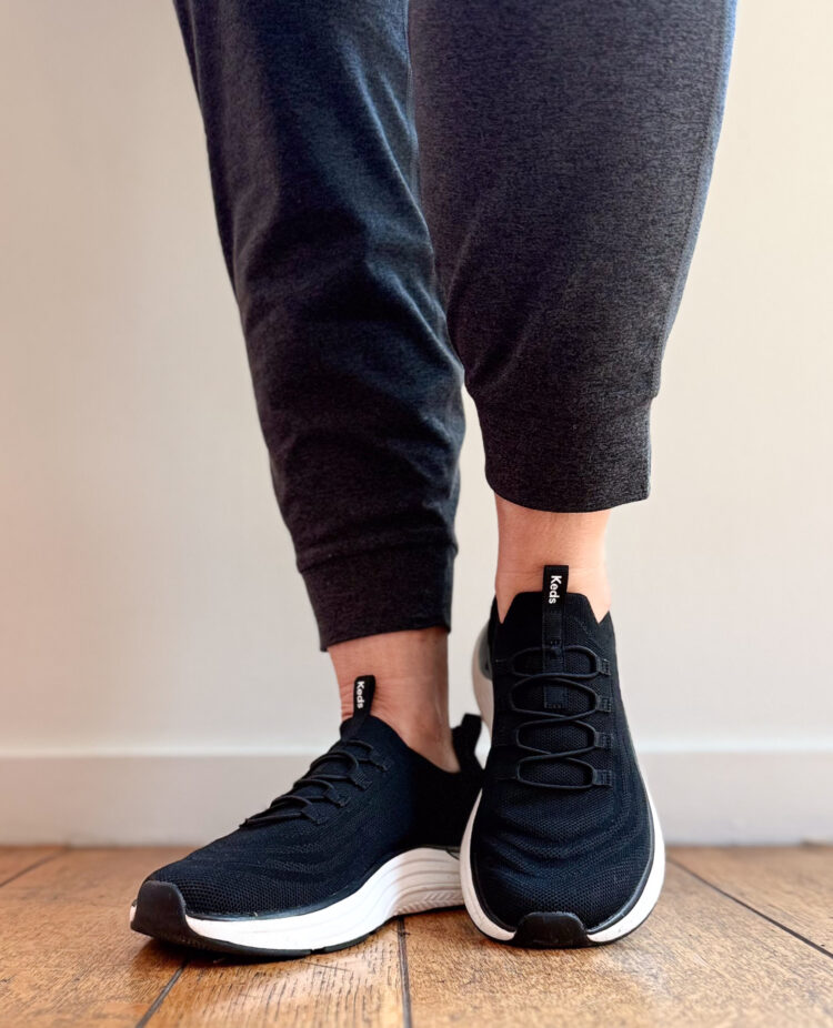 Keds BlissMove Sneaker Review: What One Wardrobe Oxygen Reader Really Thinks 2 keds blissmove sneaker review 2026 featuring a pair of the sneakers in black marl on a person wearing black joggers