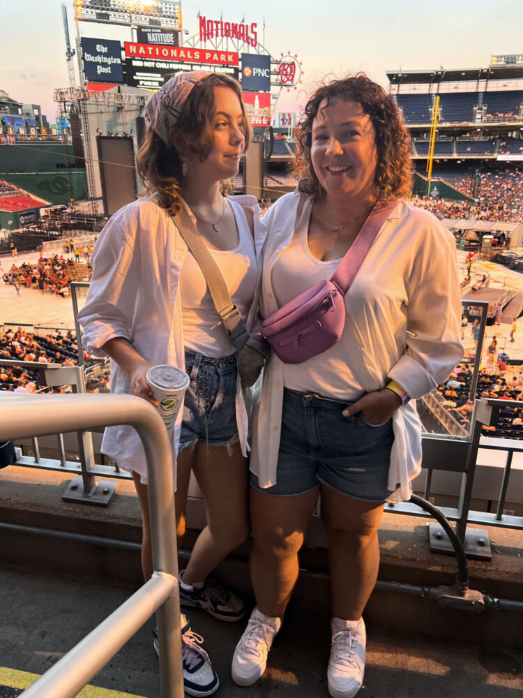 Woman and teen in the stands at Nationals Park for a red Hot Chili Peppers concert